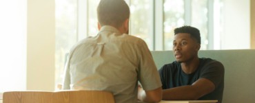 two men talking